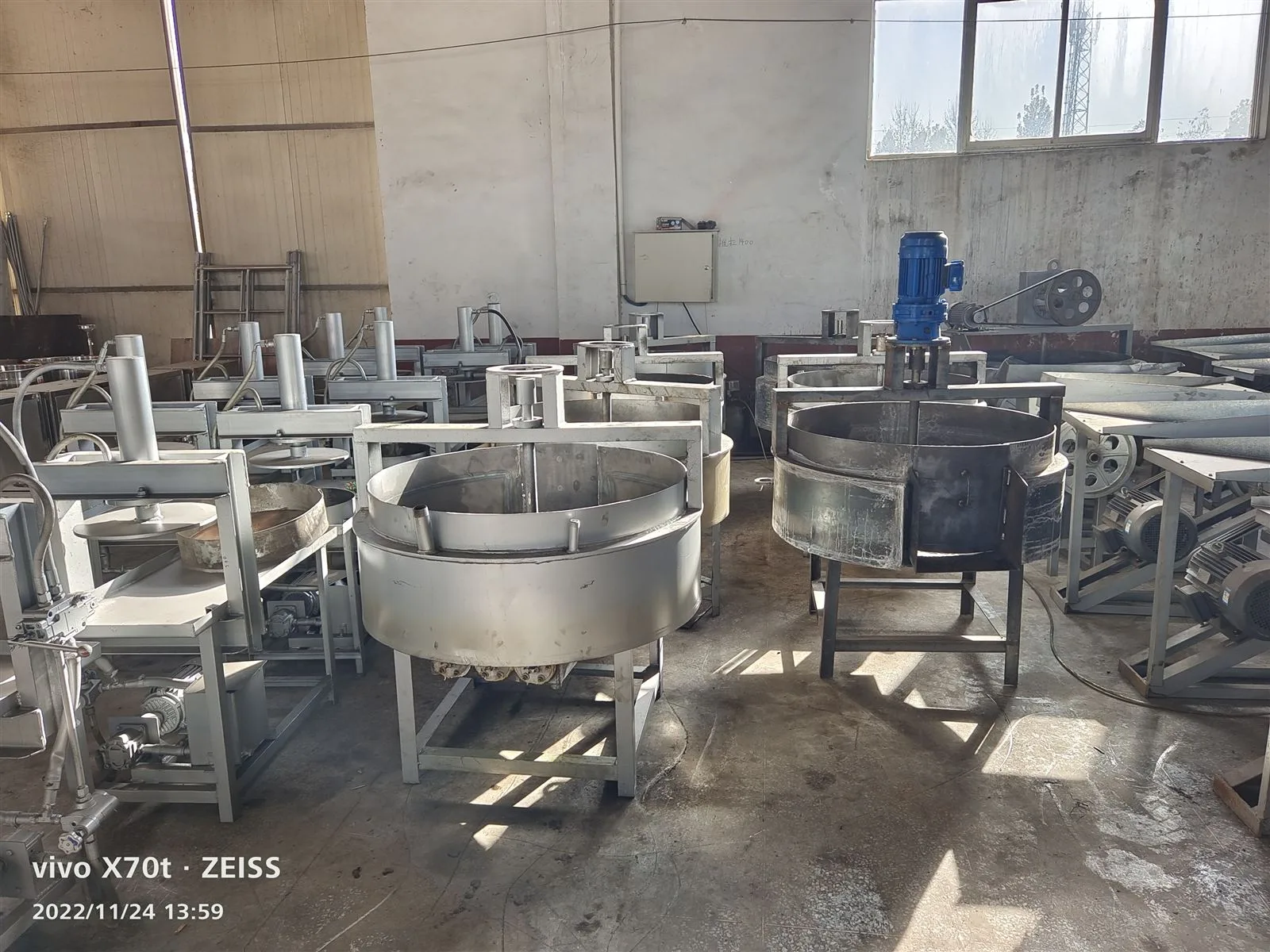 Stainless steel seed roasting pans on the factory floor