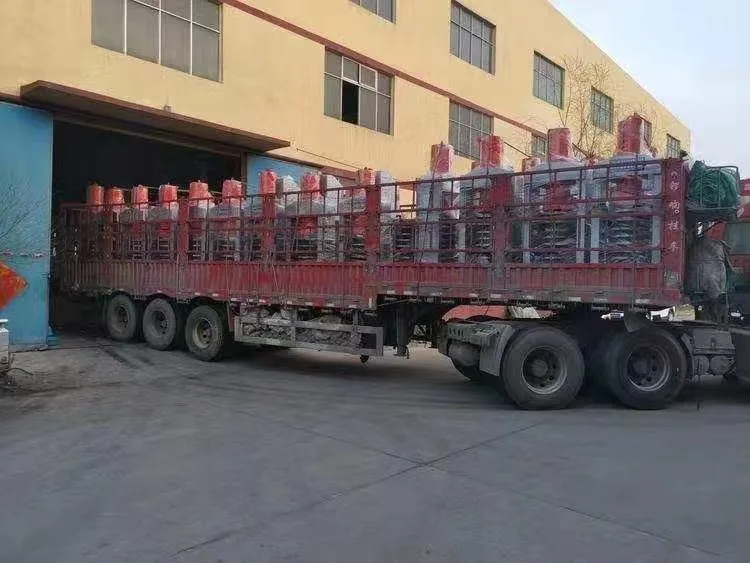 Truck loaded with packaged presses outside the factory workshop